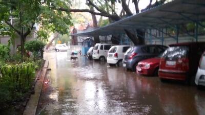 The rain showers created a deluge for many housing societies situated along the nullah on NIBM-Kausarbaug road. (HT PHOTO)