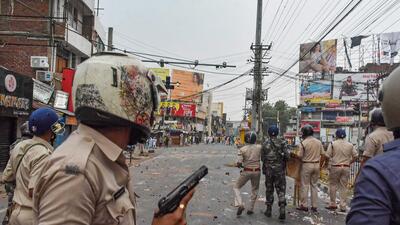 Security personnel chase away people protesting over controversial remarks made by two former BJP spokespersons about Prophet Mohammed in Ranchi on Friday (PTI) Security personnel chase away people protesting over controversial remarks made by two former BJP spokespersons about Prophet Mohammed in Ranchi on Friday (PTI)