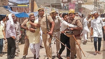Saharanpur: Police attempt to detain protestors during a demonstration over the controversial remarks by two now-suspended BJP leaders against Prophet Mohammad. (PTI) Saharanpur: Police attempt to detain protestors during a demonstration over the controversial remarks by two now-suspended BJP leaders against Prophet Mohammad. (PTI)