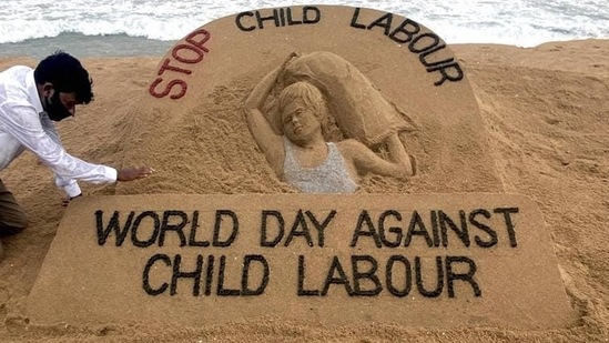 Puri: Artist Sudarsan Patnaik gives finishing touches to a sand sculpture with a message, Stop Child Labour, ahead of World Day against Child Labour, in Puri, Thursday, June 11, 2020. (PTI Photo)(PTI11-06-2020_000162A) (PTI)