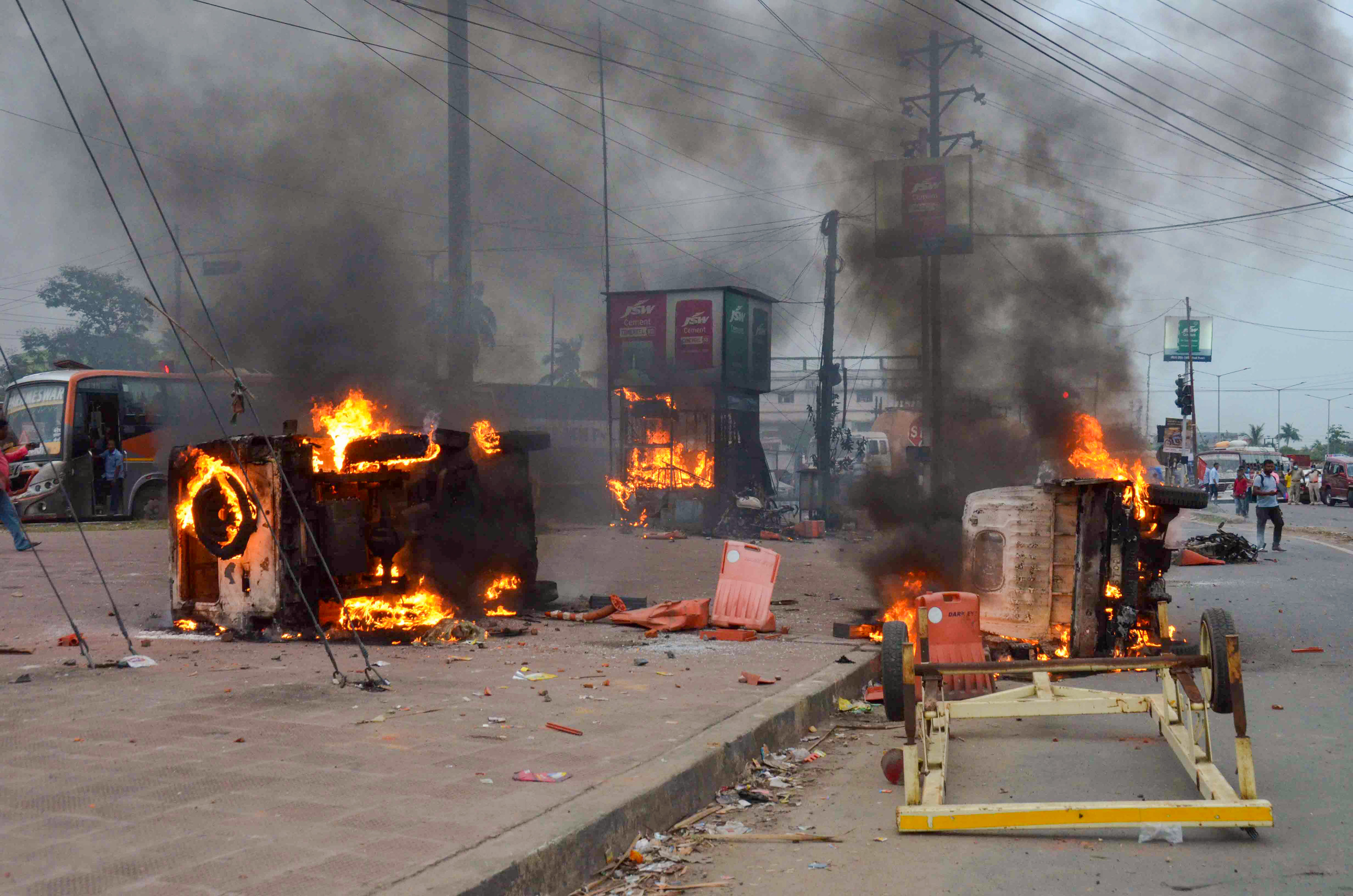 Flames and smoke rise from vehicles on fire, that were allegedly set ablaze by miscreants during a protest in Howrah. (PTI) Flames and smoke rise from vehicles on fire, that were allegedly set ablaze by miscreants during a protest in Howrah. (PTI)