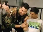 Varun Dhawan with a fan. Varun Dhawan with a fan.