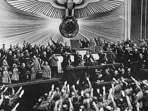 German Nazi chancellor Adolf Hitler (centre) receives an ovation from the Reichstag and members of parliament who give him the nazi salute.(AFP Photo) German Nazi chancellor Adolf Hitler (centre) receives an ovation from the Reichstag and members of parliament who give him the nazi salute.(AFP Photo)