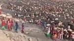 The video showing a large number of women and men coming out of a mine carrying coal-filled sacks on their shoulders and heads went viral on social media platforms. (Video grab) The video showing a large number of women and men coming out of a mine carrying coal-filled sacks on their shoulders and heads went viral on social media platforms. (Video grab)