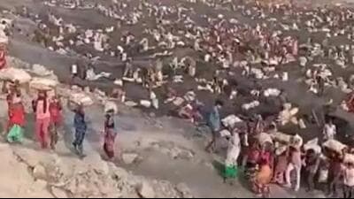 The video showing a large number of women and men coming out of a mine carrying coal-filled sacks on their shoulders and heads went viral on social media platforms. (Video grab) The video showing a large number of women and men coming out of a mine carrying coal-filled sacks on their shoulders and heads went viral on social media platforms. (Video grab)