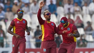 Nicholas Pooran celebrates with teammates after taking the wicket of Mohammad Rizwan (AP)