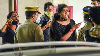 Trans women interact with police after they were allegedly taken into custody for wearing black clothes near the venue of a programme of Kerala chief minister Pinarayi Vijayan, in Kochi on Saturday. (PTI) Trans women interact with police after they were allegedly taken into custody for wearing black clothes near the venue of a programme of Kerala chief minister Pinarayi Vijayan, in Kochi on Saturday. (PTI)