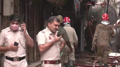 Firemen and Delhi police personnel in Gaffar market in Delhi's Karol Bagh. (ANI) Firemen and Delhi police personnel in Gaffar market in Delhi's Karol Bagh. (ANI)