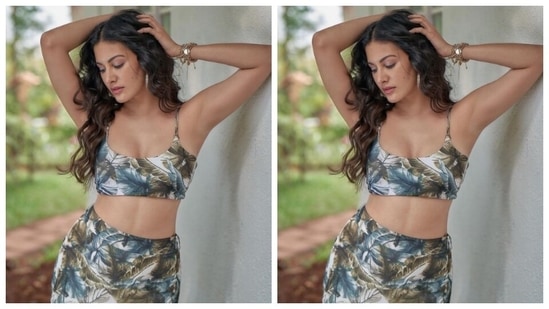 The attire featured a white cropped top intricately printed in blue and moss green patterns. Amyra paired it with a bodycon skirt of the same print.(Instagram/@amyradastur93)