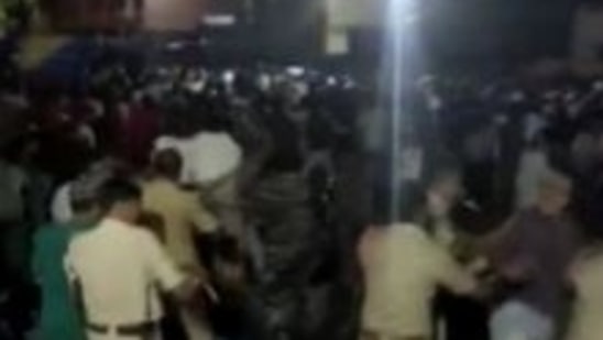 Telangana: Cops seen dispersing the crowd outside a police station.&nbsp;