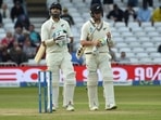 New Zealand's Daryl Mitchell, left, and Matt Henry leave the field at the end of the play on the fourth day New Zealand's Daryl Mitchell, left, and Matt Henry leave the field at the end of the play on the fourth day