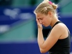 Tennis player Jelena Dokic, representing Australia, reacts during a match against France's Karla Mraz, in Bucharest, Romania Tennis player Jelena Dokic, representing Australia, reacts during a match against France's Karla Mraz, in Bucharest, Romania