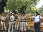 New Delhi: Police personnel stand guard near ED office, during summoning of Congress leader Rahul Gandhi in the National Herald case, in New Delhi, Monday, June 13, 2022.&nbsp;