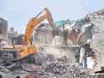 Bulldozer being used to demolish the 'illegally constructed' residence of Javed Ahmed in Prayagraj on Sunday. Bulldozer being used to demolish the 'illegally constructed' residence of Javed Ahmed in Prayagraj on Sunday. 