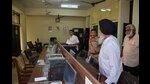 Court officials who had reached the DEO’s office to attach assets, on Monday. (Harvinder Singh/HT) Court officials who had reached the DEO’s office to attach assets, on Monday. (Harvinder Singh/HT)