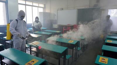 Mumbai, India - December 14, 2021: School workers sanitize and fumigate the classrooms of 1st to 7th Standard before resuming offline classes from tomorrow, in Mumbai, India, on Tuesday, December 14, 2021. (Photo by Satish Bate/Hindustan Times) (Satish Bate/HT PHOTO) Mumbai, India - December 14, 2021: School workers sanitize and fumigate the classrooms of 1st to 7th Standard before resuming offline classes from tomorrow, in Mumbai, India, on Tuesday, December 14, 2021. (Photo by Satish Bate/Hindustan Times) (Satish Bate/HT PHOTO)