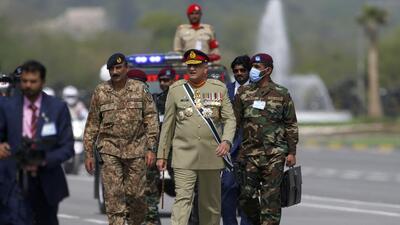 Pakistan’s army chief General Qamar Javed Bajwa (centre) arrives to attend a military parade to mark National Day in Islamabad, on March 23, 2022. (AP/FILE)