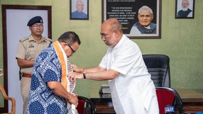 Senior Manipur insurgent leader Irom Ibotombi Meitei with chief minister Biren Singh in Imphal on Monday. (Twitter Photo)