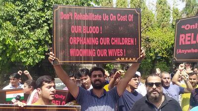 Hundreds of employees, both men and women, assembled under the banner of All Migrant Employee Association Kashmir outside the Press Club carrying placards (ANI) Hundreds of employees, both men and women, assembled under the banner of All Migrant Employee Association Kashmir outside the Press Club carrying placards (ANI)