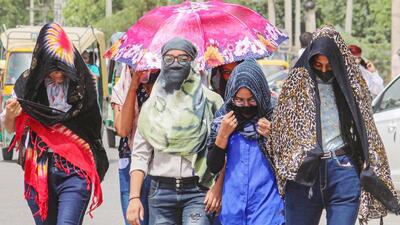 Women shield themselves from heat in the national capital region. (PTI File Photo)