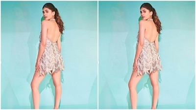 Sanjana’s short dress featured halter neck and embellishments in silver feather-like fabric. The dress also came with backless details. (Instagram/@sanjanasanghi96)