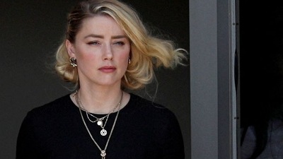 FILE PHOTO: Amber Heard leaves Fairfax County Circuit Courthouse after the jury announced split verdicts  in the Depp v. Heard civil defamation trial at the Fairfax County Circuit Courthouse in Fairfax, Virginia, U.S., June 1, 2022. REUTERS/Tom Brenner (REUTERS)