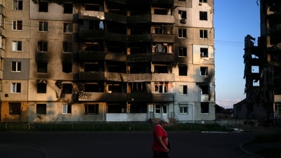 A woman walks in front of a building destroyed by attacks, in Borodyanka, on the outskirts of Kyiv, Ukraine. (AP File image) A woman walks in front of a building destroyed by attacks, in Borodyanka, on the outskirts of Kyiv, Ukraine. (AP File image)