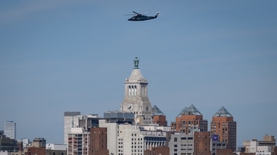 A helicopter flies above the city skyline of New York. (AFP)