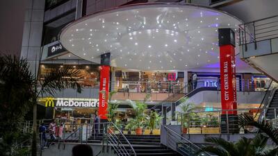 A shopping mall in Hyderabad: Prices edged down slightly compared to April mainly on account of a statistical base effect and a cut in central excise duties on petrol and diesel (Bloomberg File Photo) A shopping mall in Hyderabad: Prices edged down slightly compared to April mainly on account of a statistical base effect and a cut in central excise duties on petrol and diesel (Bloomberg File Photo)