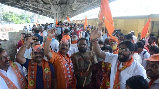 Shiv Sena workers celebrate while leaving for Ayodhya by a special train as Maharashtra Tourism and Environment Minister Aaditya Thackeray will visit on June 15 to pay obeisance to Ram Lalla, at Thane Railway Station on Monday. (Praful Gangurde/HT Photo)