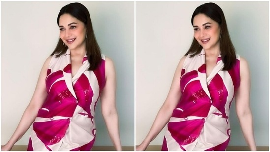Madhuri teamed a sleeveless pink and white printed satin long top with a pair of satin trousers of the same print. In silver earrings and transparent stilettos, she completed the look.(Instagram/@madhuridixitnene)