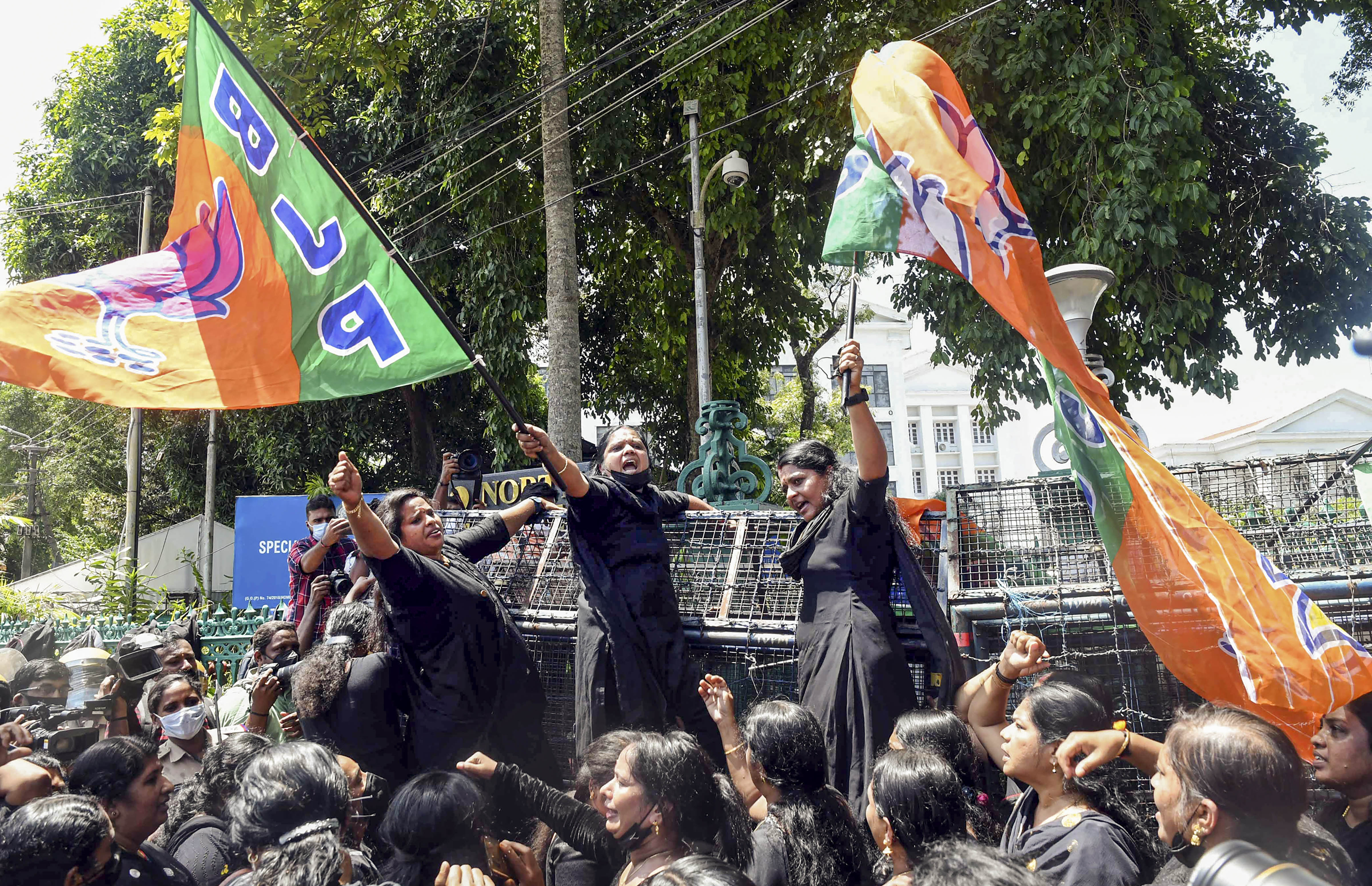 BJP workers stage protest demanding the resignation of Kerala chief minister Pinarayi Vijayan for his alleged involvement in a gold smuggling case. (PTI) BJP workers stage protest demanding the resignation of Kerala chief minister Pinarayi Vijayan for his alleged involvement in a gold smuggling case. (PTI)