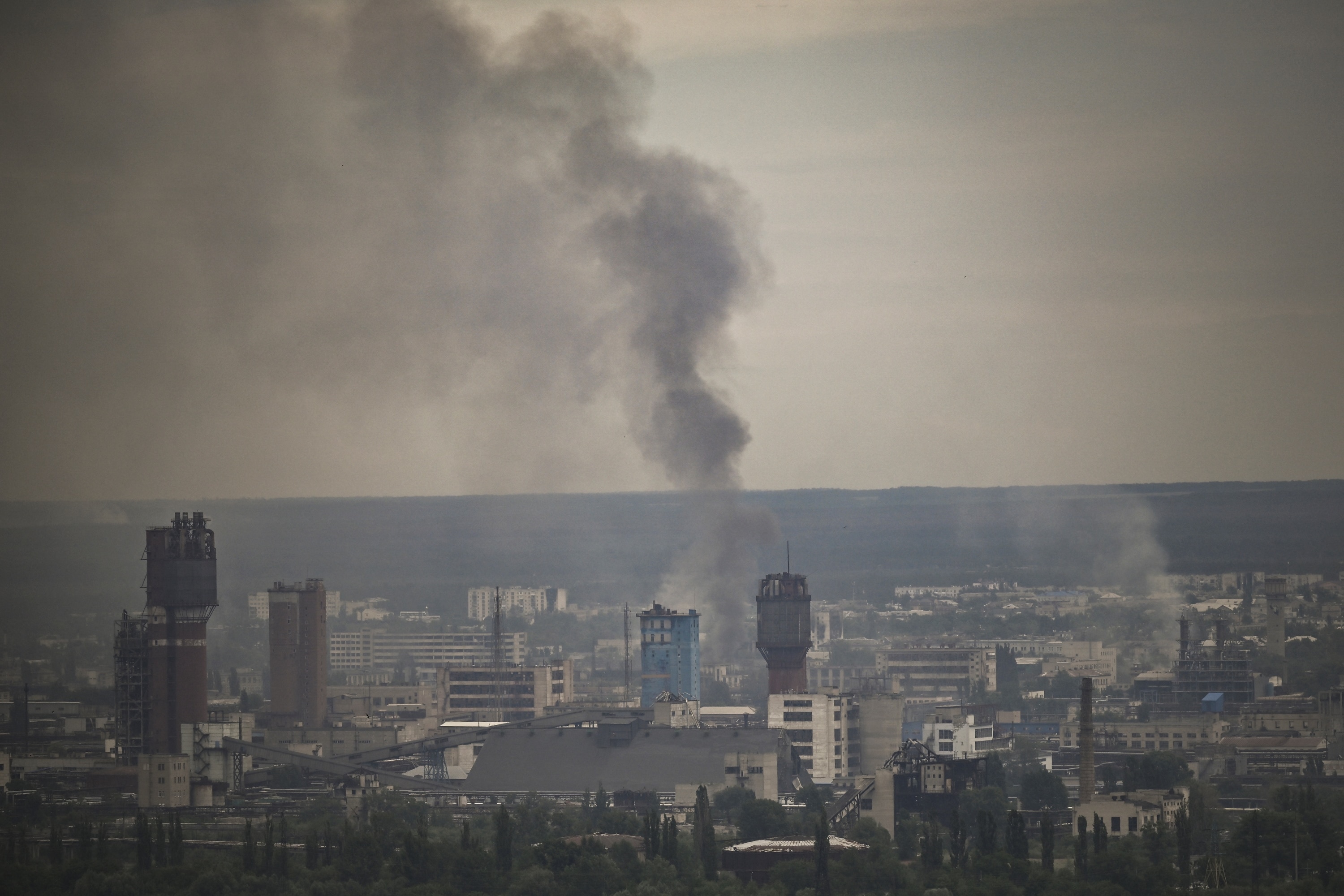 Smoke rises from the city of Severodonetsk in the eastern Ukrainian region of Donbas on June 13, 2022. (AFP) Smoke rises from the city of Severodonetsk in the eastern Ukrainian region of Donbas on June 13, 2022. (AFP)