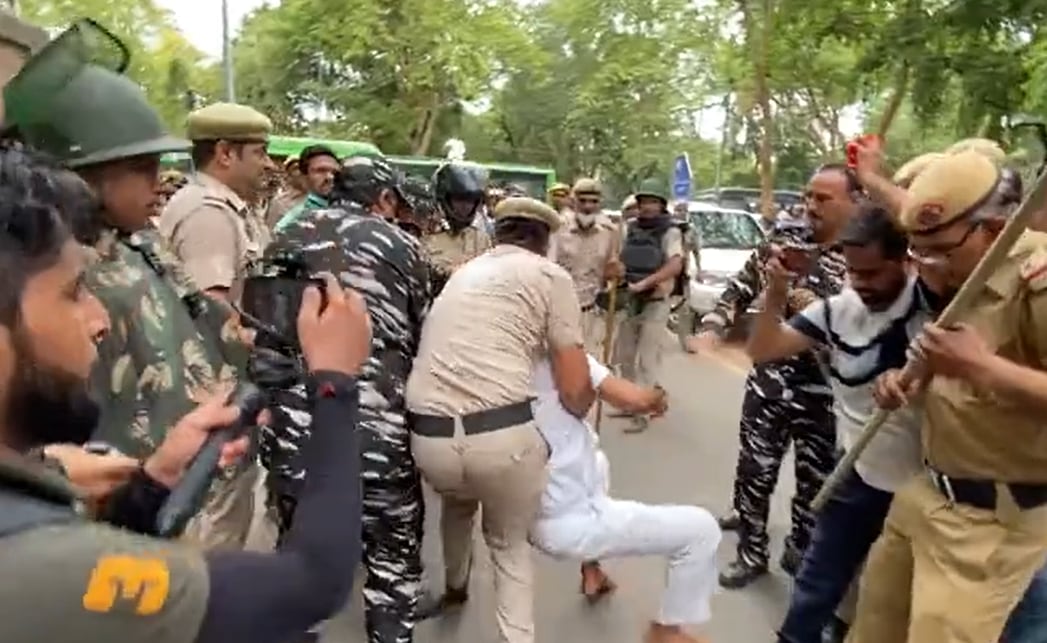 Video grab of Congress general secretary KC Venugopal being manhandled in police personnel in Delhi. (Twitter @srinivasiyc)