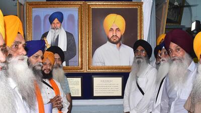 SGPC president Harjinder Singh Dhami along with other Sikh personalities unveil the portraits of former CM Beant Singh's assassin Dilawar Singh and former Akal Takht head Granthi Giani Bhagwan Singh in Central Sikh Musuem of Golden Temple complex, in Amritsar, Punjab, India, on Tuesday. (Sameer Sehgal /HT) SGPC president Harjinder Singh Dhami along with other Sikh personalities unveil the portraits of former CM Beant Singh's assassin Dilawar Singh and former Akal Takht head Granthi Giani Bhagwan Singh in Central Sikh Musuem of Golden Temple complex, in Amritsar, Punjab, India, on Tuesday. (Sameer Sehgal /HT)
