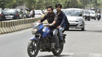 Noida, India- June 14, 2022: Commuters driving without helmet, According to data from the traffic police, driving without helmet, unauthorised parking and driving on the wrong side are among the top traffic offences in Gautam Budh Nagar. In just the first five months, traffic police have issued over two lakh challans , in Noida, India, on Tuesday, June 14, 2022. (Photo by Sunil Ghosh / Hindustan Times) To go with Snehil’s story Noida, India- June 14, 2022: Commuters driving without helmet, According to data from the traffic police, driving without helmet, unauthorised parking and driving on the wrong side are among the top traffic offences in Gautam Budh Nagar. In just the first five months, traffic police have issued over two lakh challans , in Noida, India, on Tuesday, June 14, 2022. (Photo by Sunil Ghosh / Hindustan Times) To go with Snehil’s story