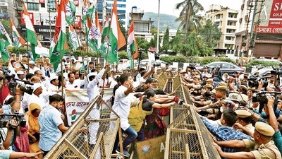 Police personnel try to stop Congress supporters, during a protest in Guwahati on Monday. (ANI) Police personnel try to stop Congress supporters, during a protest in Guwahati on Monday. (ANI)