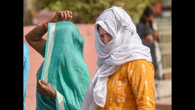 Women use scarves to shield themselves from the heat on hot summer afternoon, New Delhi, June 8, 2022 (PTI) Women use scarves to shield themselves from the heat on hot summer afternoon, New Delhi, June 8, 2022 (PTI)
