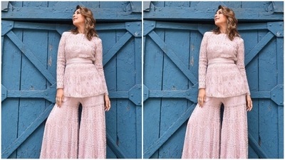 Styled by fashion stylist Romi Choudhary, Sonali wore her shoulder-length tresses open in soft wavy curls as she posed for the cameras. (Instagram/@iamsonalibendre)