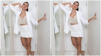 Sonnalli teamed a pearl bralette with a white blazer and a white pencil skirt as she posed like a diva. (Instagram/@sonnalliseygall)