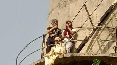 When contacted, the MLA refuted the allegations. He said he had made the woman come down from the water tanker and had nothing to do with the FIR being lodged against the former sarpanch of Mangewal village in Malaud, Ludhiana. (HT PHOTO)