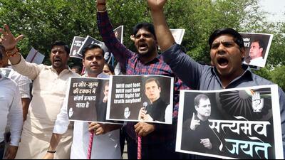 Congress supporters staging a protest over ED’s summon to Rahul Gandhi on Monday. (ANI) Congress supporters staging a protest over ED’s summon to Rahul Gandhi on Monday. (ANI)