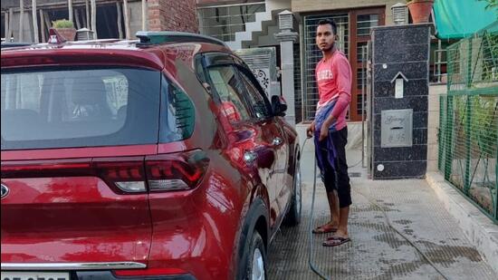 Most of the challans were issued to those washing their vehicles and watering lawns using hosepipes. (HT Photo)