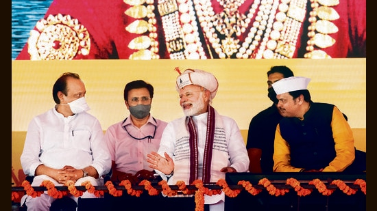(From Left) Deputy chief minister of Maharashtra Ajit Pawar, Prime Minister Narendra Modi, and leader of opposition Devendra Fadnavis at the event on Tuesday. (Pratham Gokhale/HT Photo)