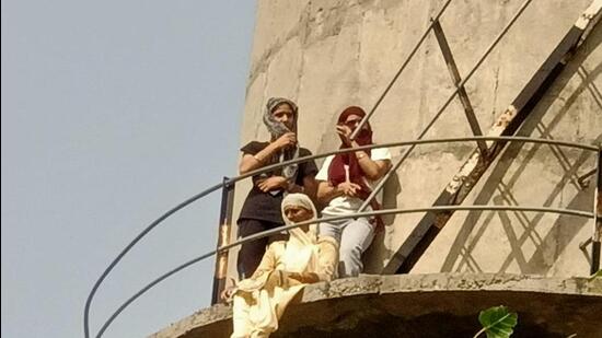 When contacted, the MLA refuted the allegations. He said he had made the woman come down from the water tanker and had nothing to do with the FIR being lodged against the former sarpanch of Mangewal village in Malaud, Ludhiana. (HT PHOTO)