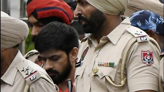Lawrence Bishnoi being produced in Delhi court in connection with the killing of Congress leader and Punjabi singer Sidhu Moosewala, in New Delhi on Tuesday. (Agencies)