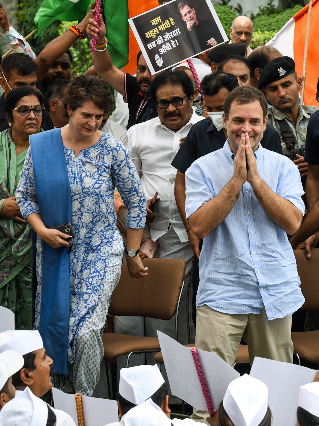 Congress leader Rahul Gandhi greets party supporters as he leaves the AICC headquarters to appear before the ED on Tuesday. (ANI)