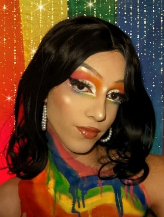 Sanat in Pride colours, wearing makeup and expressing their style freely. Sanat in Pride colours, wearing makeup and expressing their style freely. 