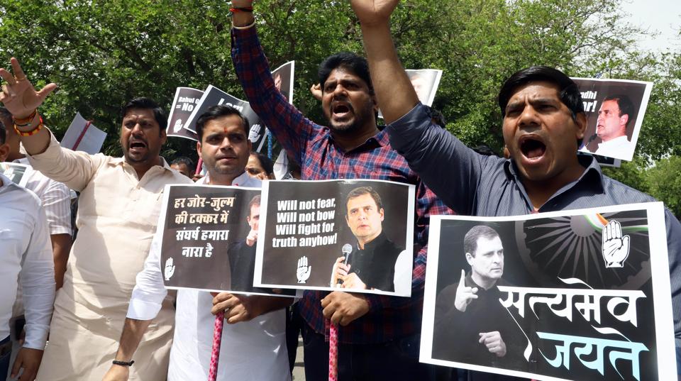 Congress supporters staging a protest over ED’s summon to Rahul Gandhi on Monday. (ANI)
