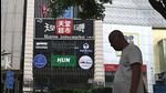 A man walks past the Heaven Supermarket bar where a Covid-19 coronavirus outbreak emerged in the Chaoyang district of Beijing on Wednesday. (AFP) A man walks past the Heaven Supermarket bar where a Covid-19 coronavirus outbreak emerged in the Chaoyang district of Beijing on Wednesday. (AFP)
